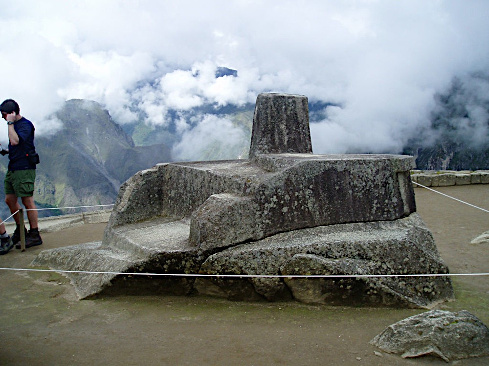 Intihuatana at Machu Picchu, from a different direction, and with a tourist for scale. Image Credit: Jordan Klein CC 2.0.