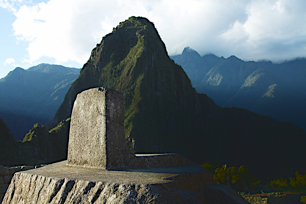 Machu Picchu Intihuatana, acting as an image rock of the mountain Huayna Picchu. Image Credit: McKay Savage 2.0.